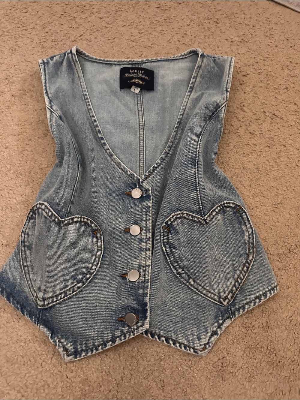 Blue denim vest with heart-shaped pockets